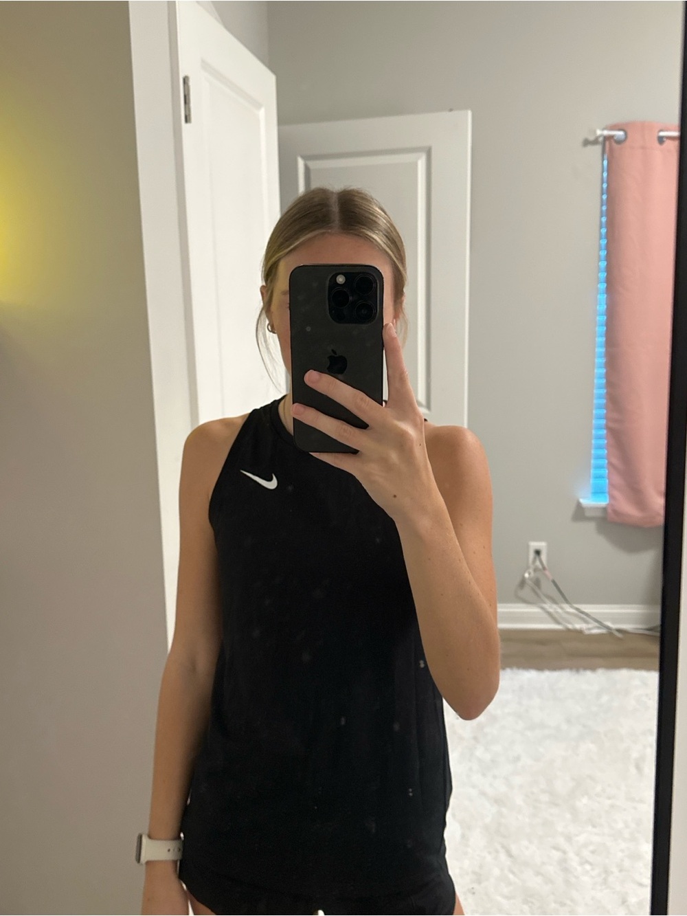 Nike Women’s Black Sleeveless Athletic Tank with White Swoosh